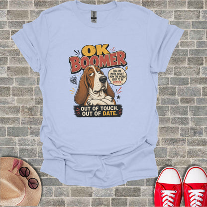 Light blue t-shirt with "OK Boomer" graphic of a dog saying "Tell me more about how the world used to be better... Out of touch. Out of date."