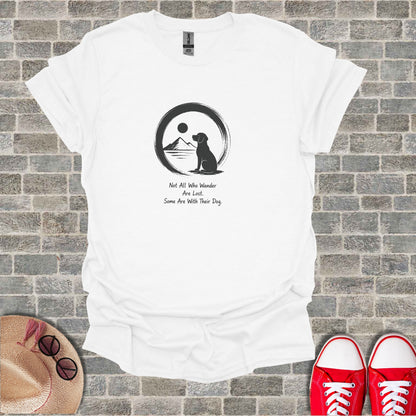 White t-shirt with black silhouette of a dog in a circle with a mountain and sun, text above.