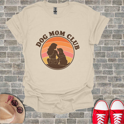 Cream t-shirt with "Dog Mom Club" graphic featuring a woman and her dog.