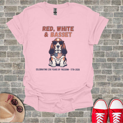 Pink t-shirt with a basset hound wearing sunglasses and a US flag bandana.