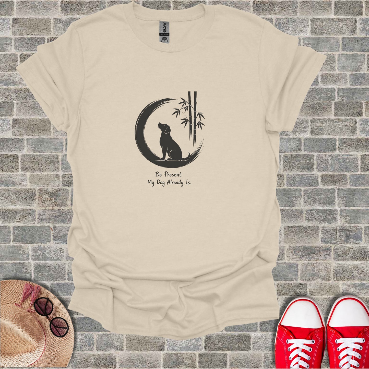 T-shirt with graphic of dog silhouette, bamboo, and text "Be Present. My Dog Already Is."