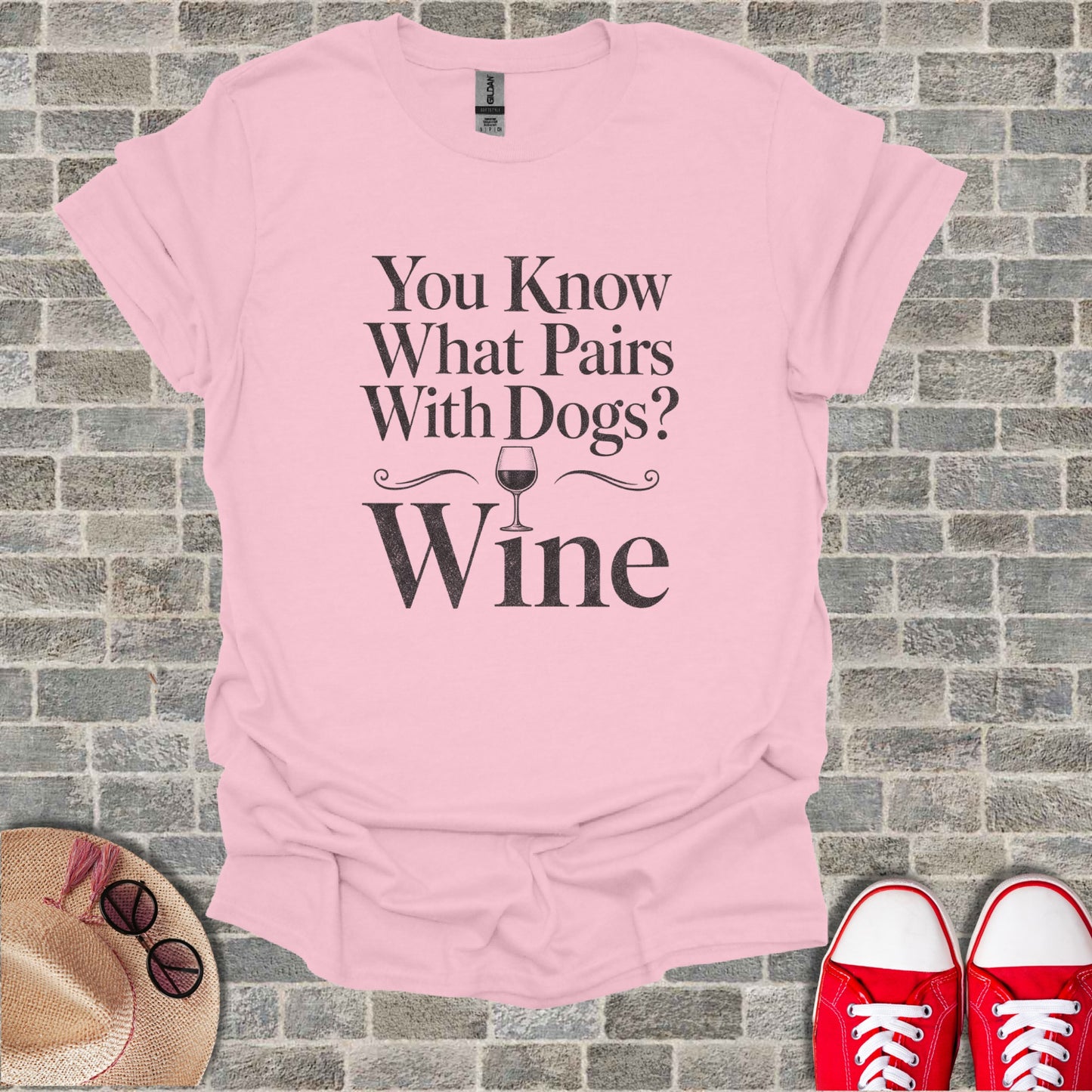 Pink t-shirt with text "You Know What Pairs With Dogs? Wine" and a wine glass graphic.