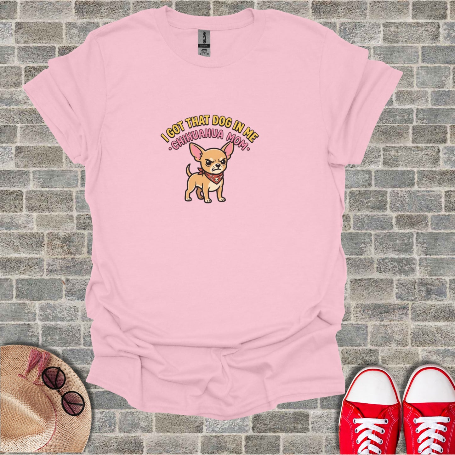 Pink t-shirt with a cartoon chihuahua and text "I GOT THAT DOG IN ME CHIHUAHUA MOM".