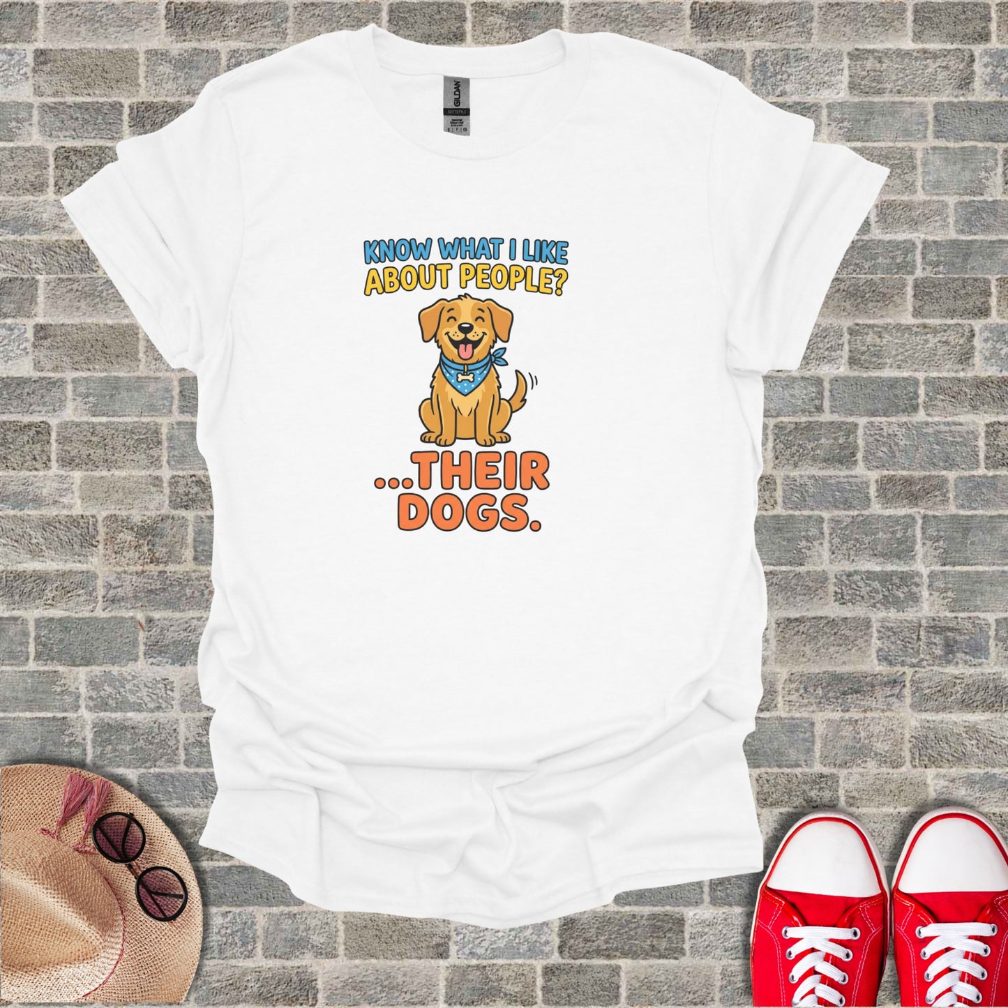 White t-shirt with "KNOW WHAT I LIKE ABOUT PEOPLE? ...THEIR DOGS." and a cartoon dog.