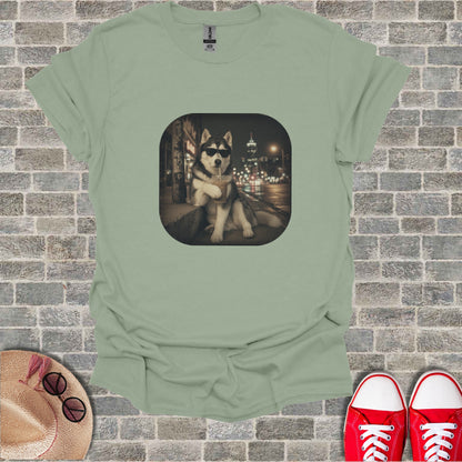 Light green t-shirt with a graphic of a husky wearing sunglasses, drinking a beverage.