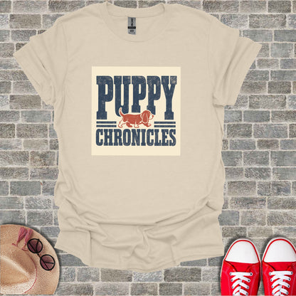 Cream t-shirt with "PUPPY CHRONICLES" text and a dog graphic.