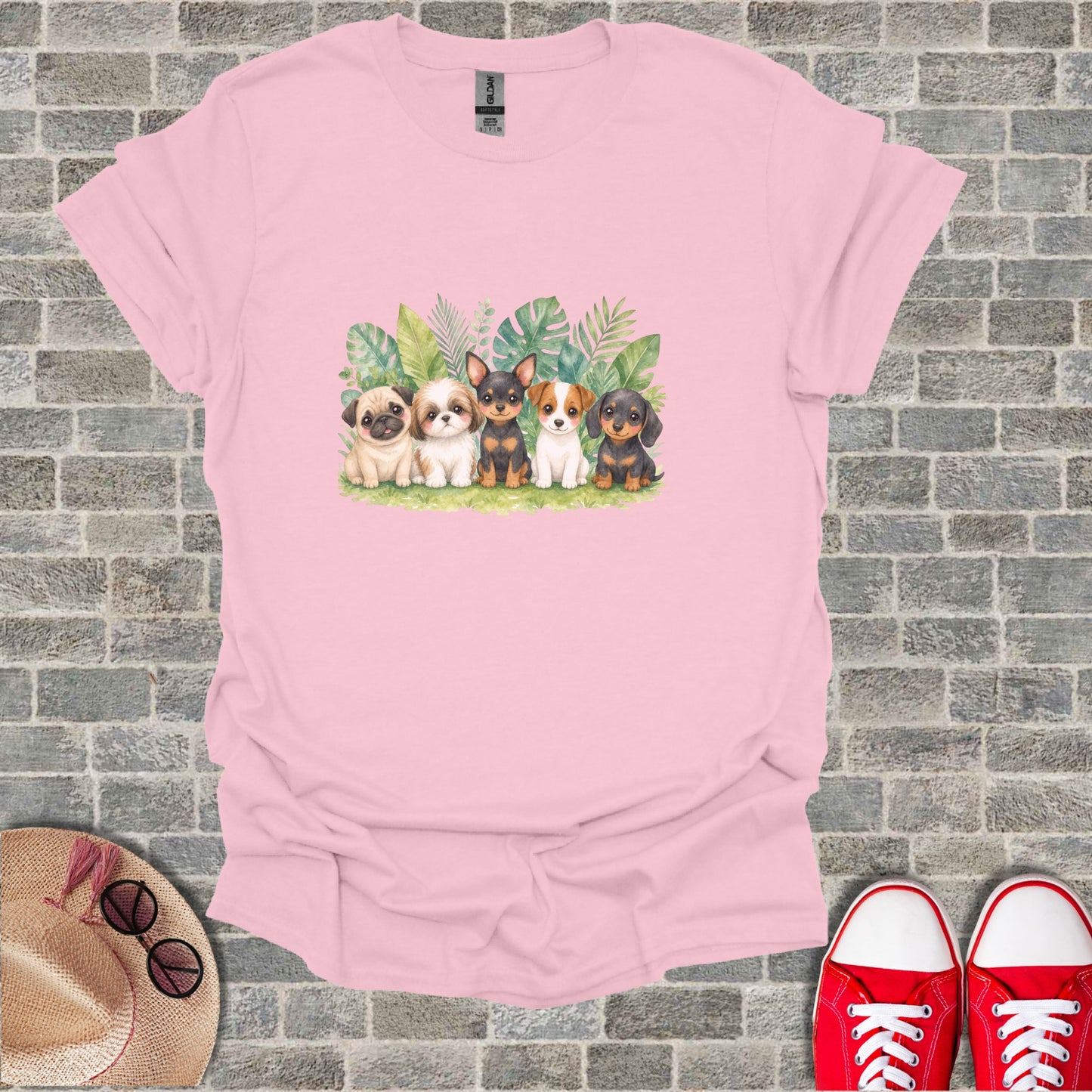 Watercolor illustration of five puppies sitting amongst tropical leaves.