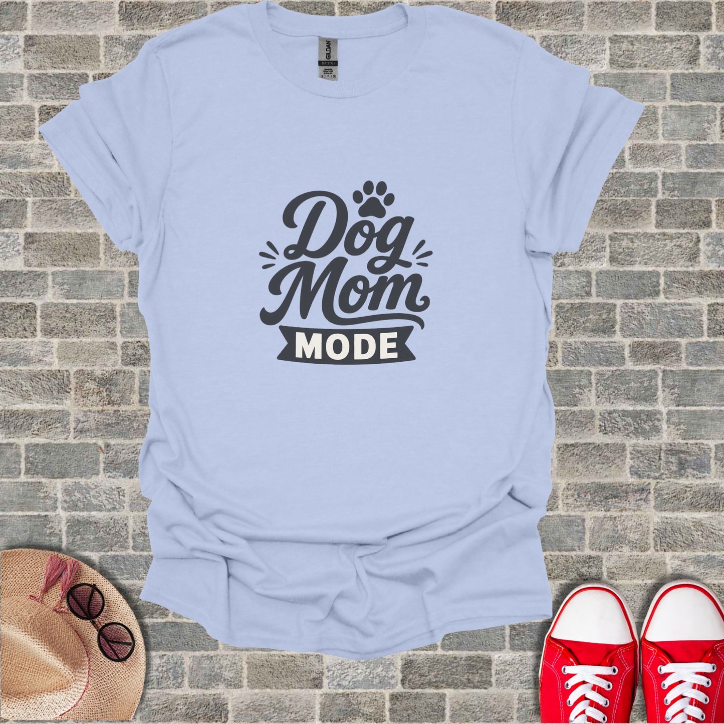Light blue t-shirt with "Dog Mom Mode" text and paw print graphic.