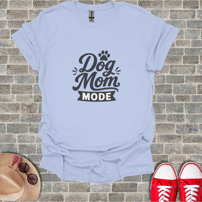 Light blue t-shirt with "Dog Mom Mode" text and paw print graphic.