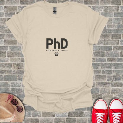 Cream t-shirt with "PhD POWERED BY DOGS" and paw print logo.