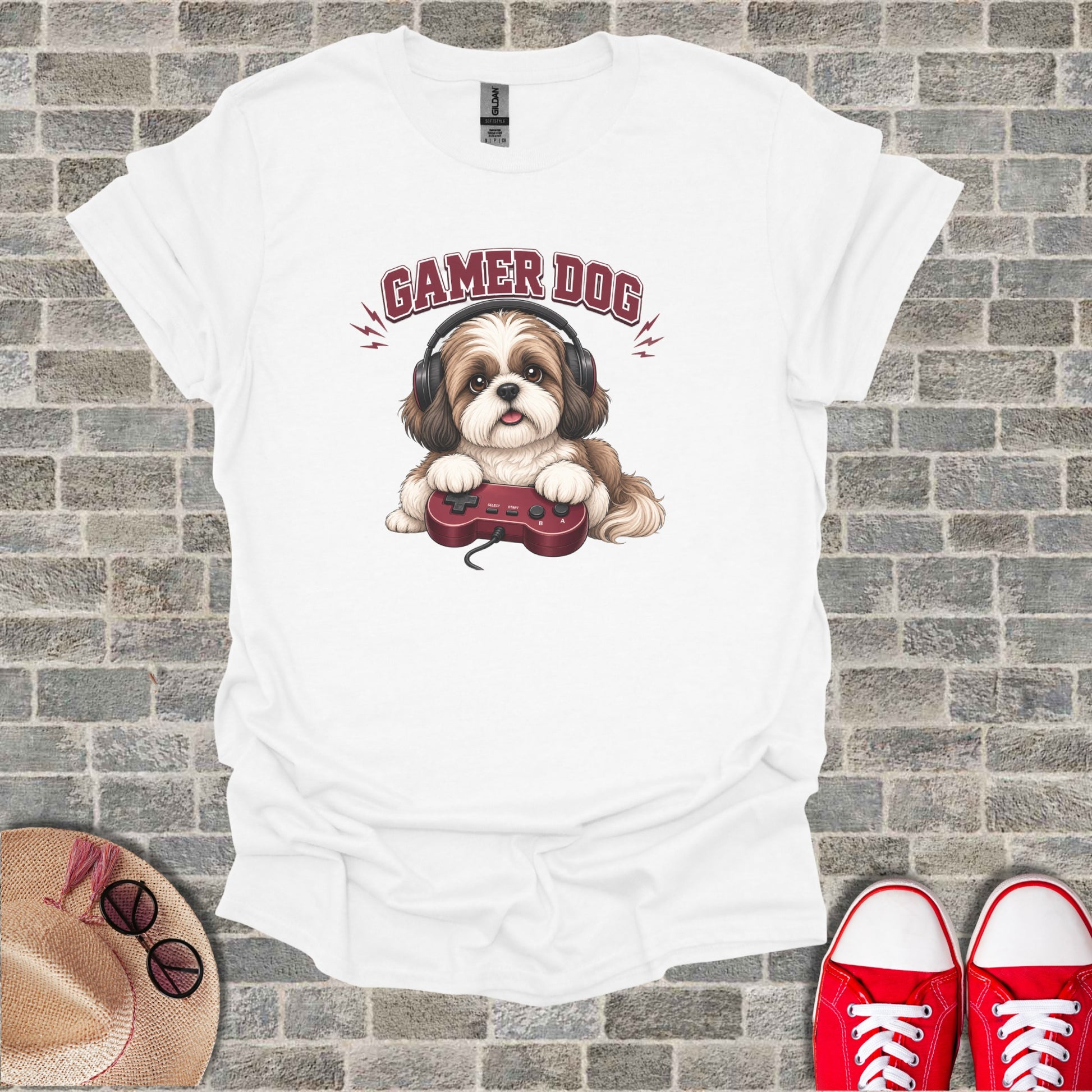 White t-shirt with cartoon gamer dog wearing headphones holding a video game controller.