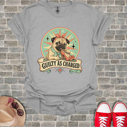 Pug wearing a bandana chews on an orange high-heeled shoe with "Guilty as Charged" text.