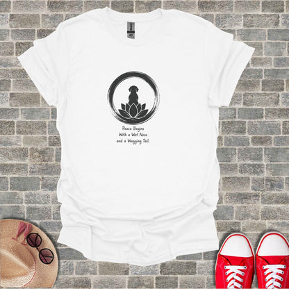 White t-shirt with black dog silhouette in a zen circle, text: "Peace Begins With a Wet Nose and a Wagging Tail."