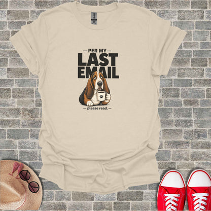 Basset hound with mug and "Per my last email" text on tan t-shirt.