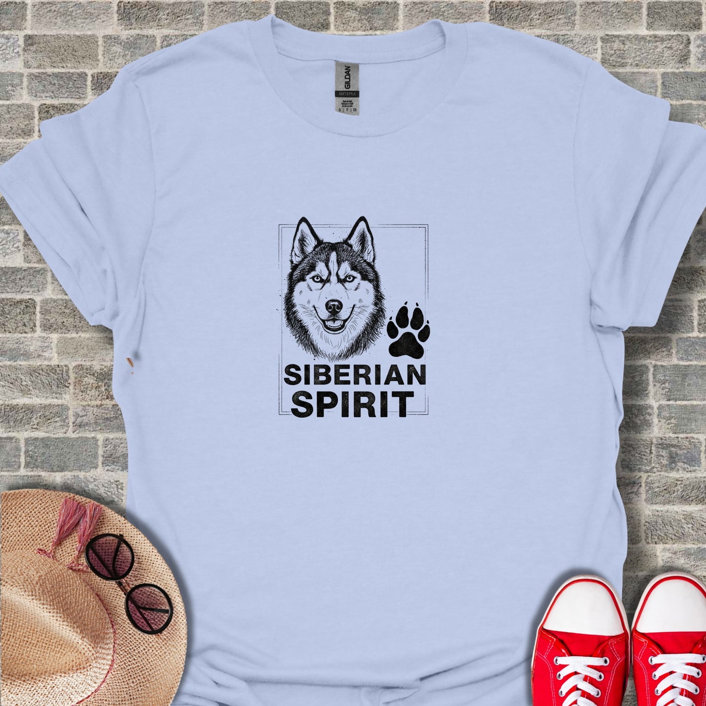 Light blue t-shirt with black Siberian Husky and paw print graphic.