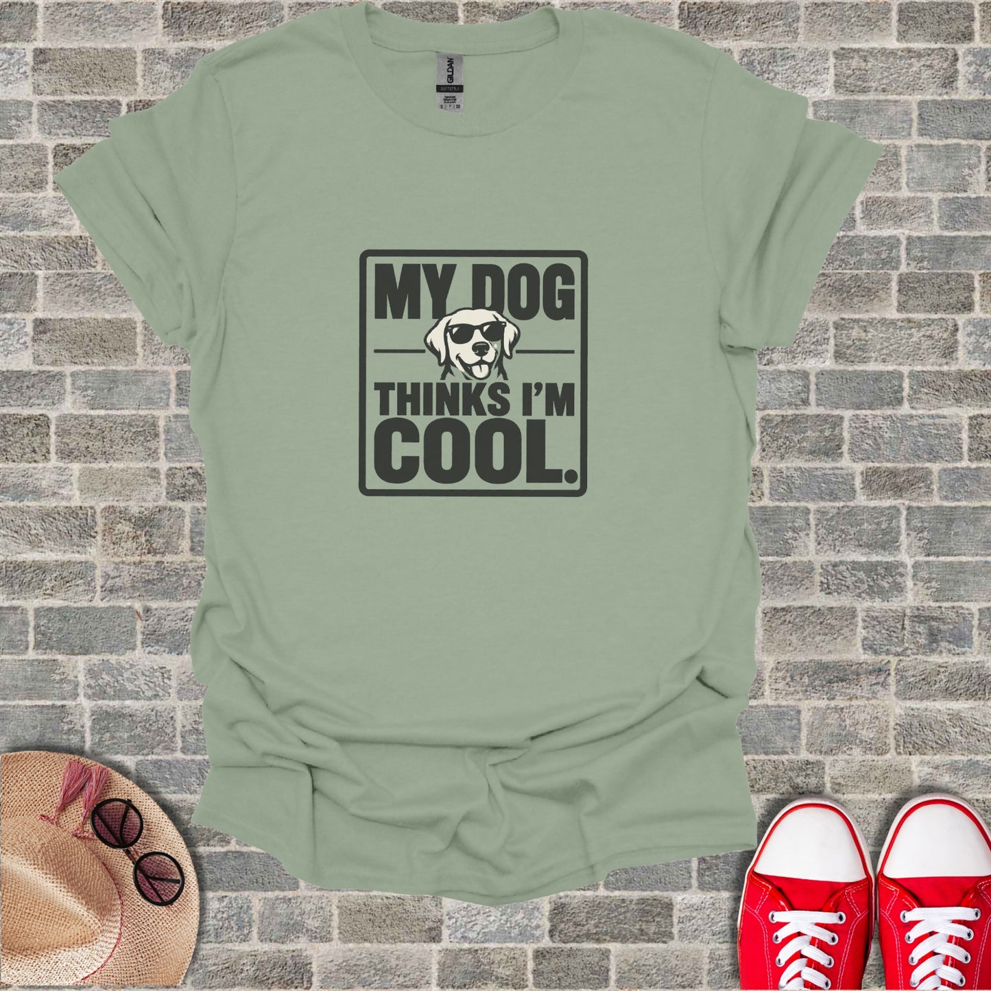 Light green t-shirt with "MY DOG THINKS I'M COOL." text and sunglasses graphic.