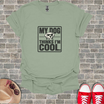 Light green t-shirt with "MY DOG THINKS I'M COOL." text and sunglasses graphic.