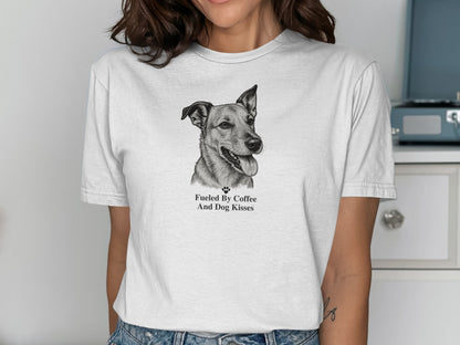White t-shirt with a sketch of a dog and text "Fueled By Coffee And Dog Kisses."