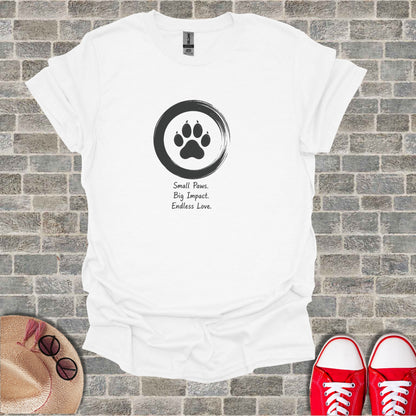 White t-shirt with a black paw print inside a circle and text.