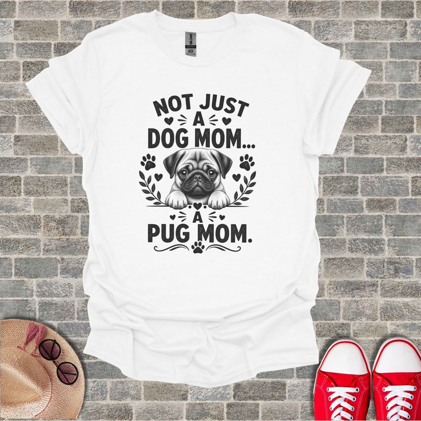 White t-shirt with "Not Just A Dog Mom... A Pug Mom" text and pug graphic.