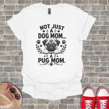 White t-shirt with "Not Just A Dog Mom... A Pug Mom" text and pug graphic.