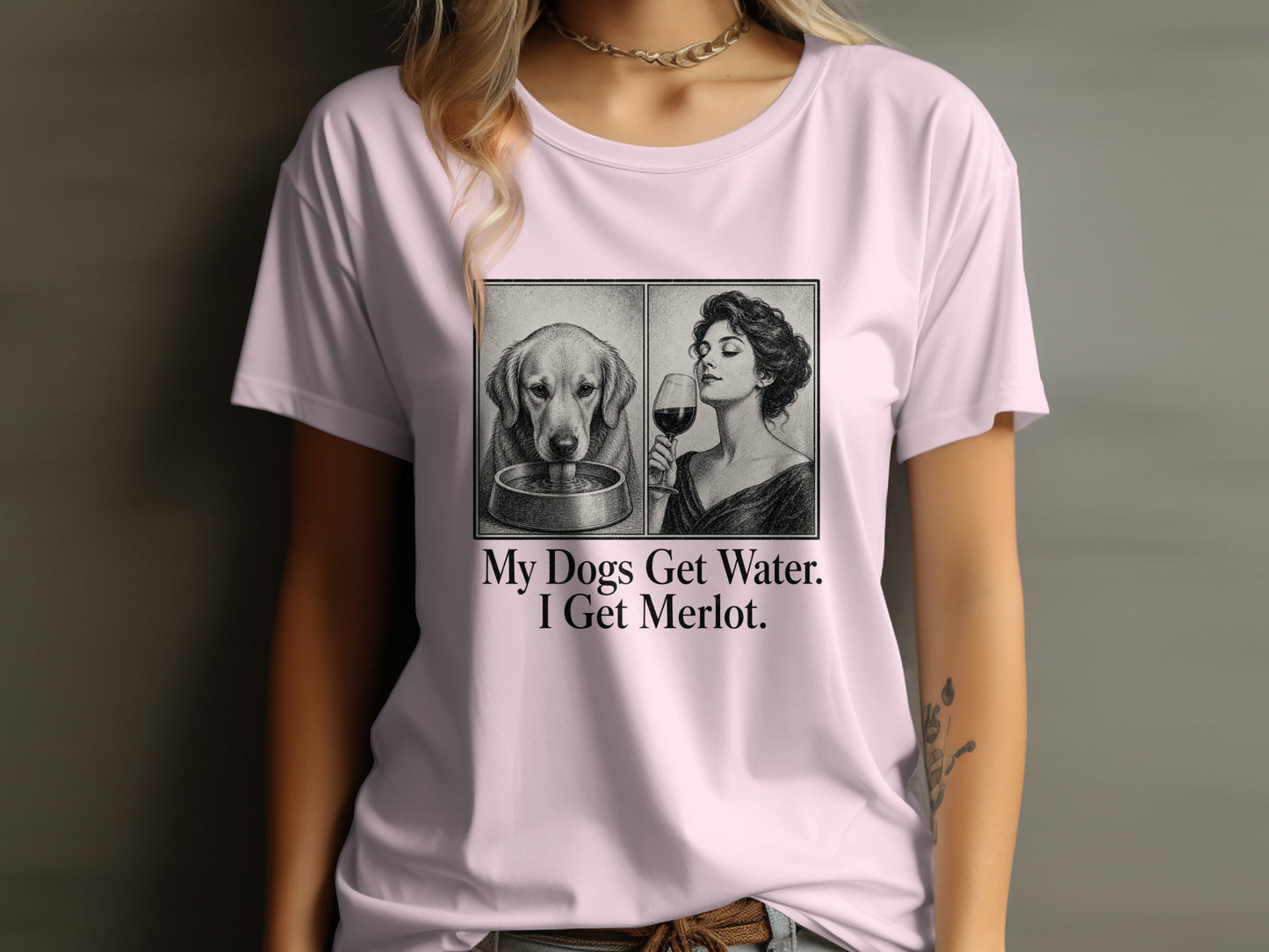 Pink t-shirt with a split sketch of a dog drinking and a woman drinking wine, text says "My dogs get water. I get Merlot."