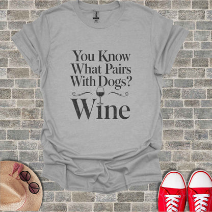 Grey t-shirt with "You Know What Pairs With Dogs? Wine" text and wine glass graphic.