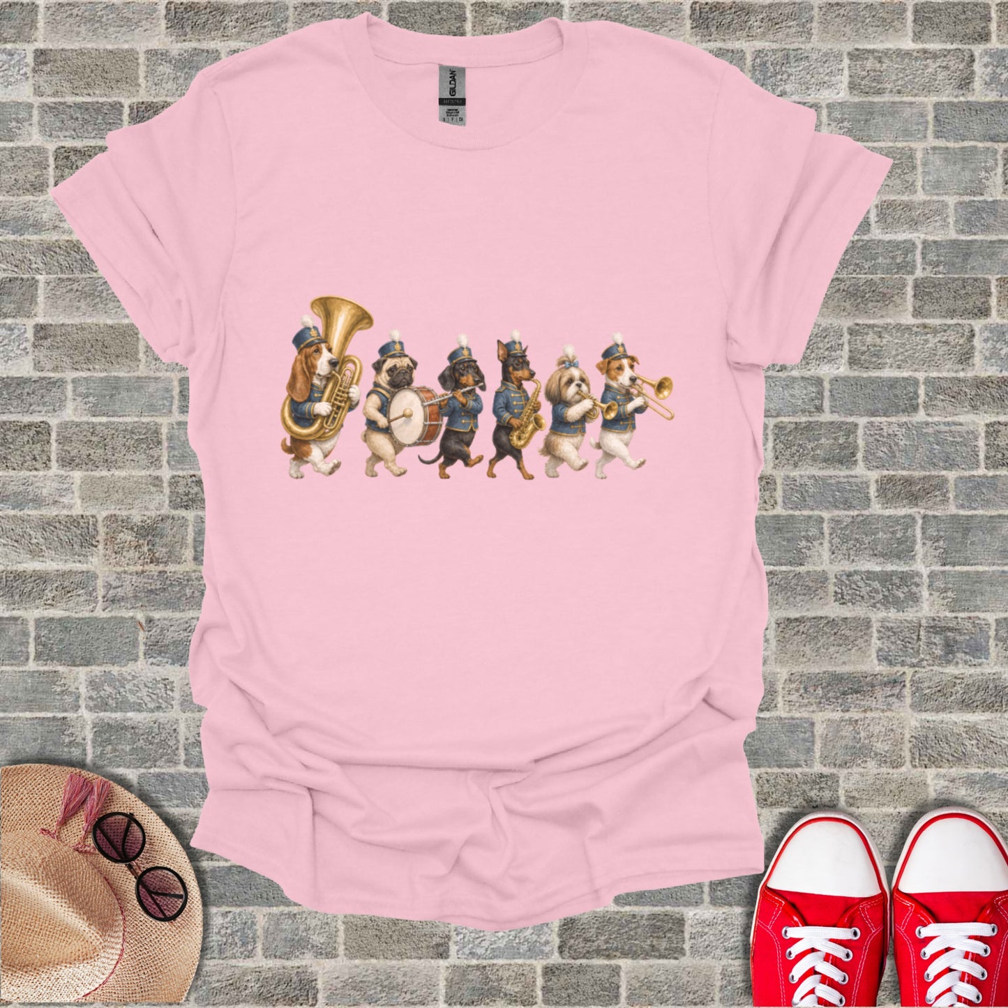 Pink t-shirt with a marching band of dogs playing instruments.