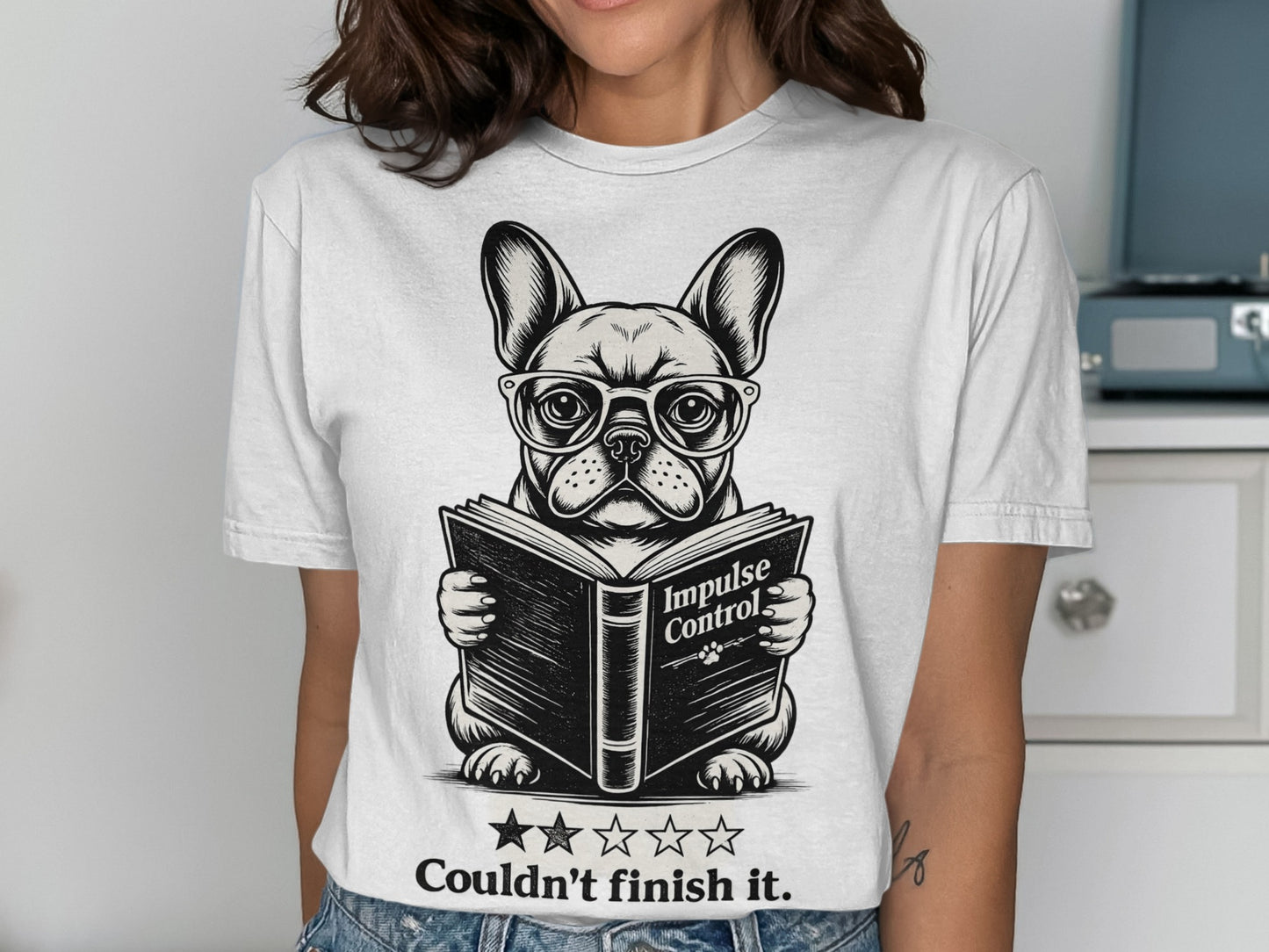 White t-shirt with graphic of French bulldog wearing glasses reading "Impulse Control".