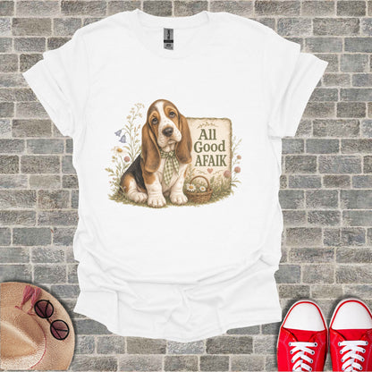 White t-shirt with a basset hound wearing a checkered bow tie and a sign saying "All Good Afaik".