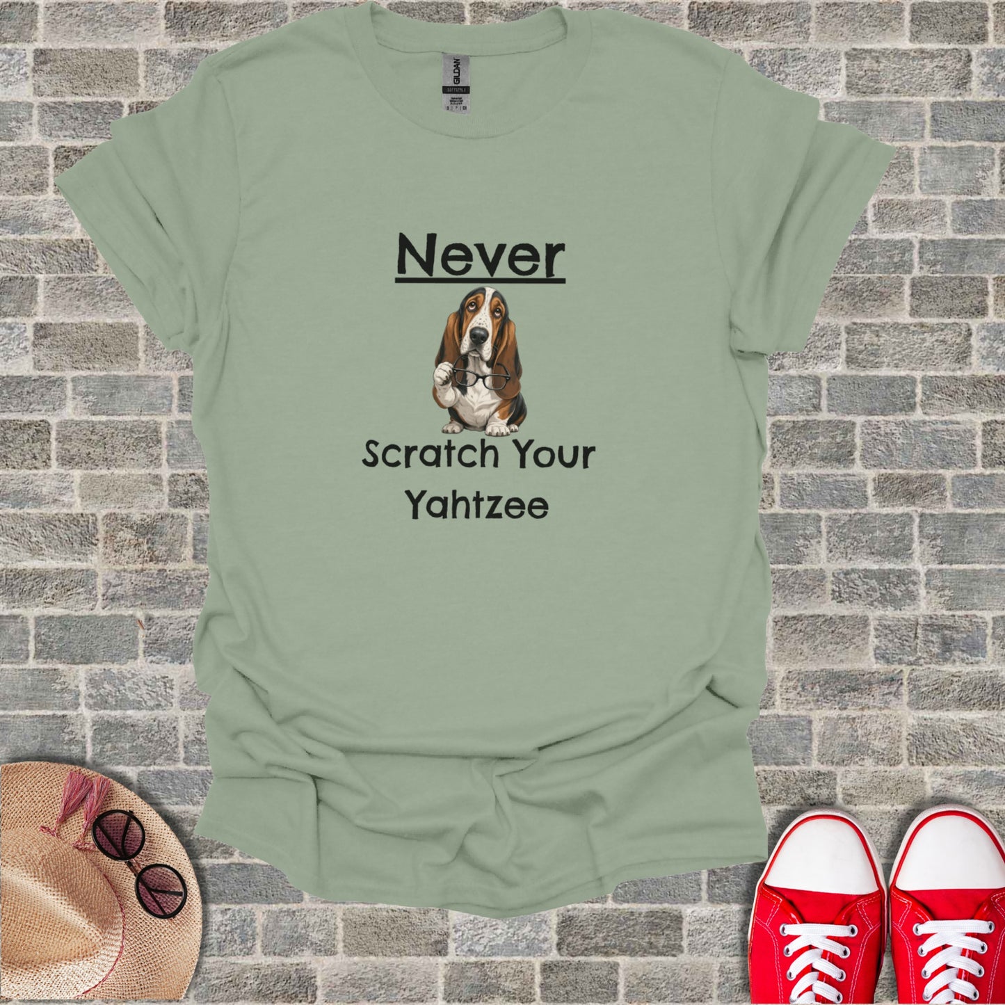 Light green t-shirt with "Never Scratch Your Yahtzee" and a basset hound graphic.
