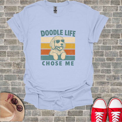 Powder blue t-shirt with text and a dog wearing sunglasses.