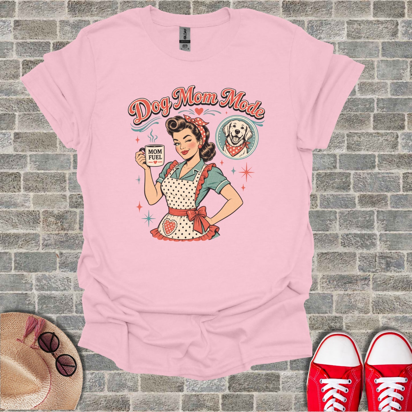 Pink t-shirt with "Dog Mom Mode" text, retro woman, and dog graphic.