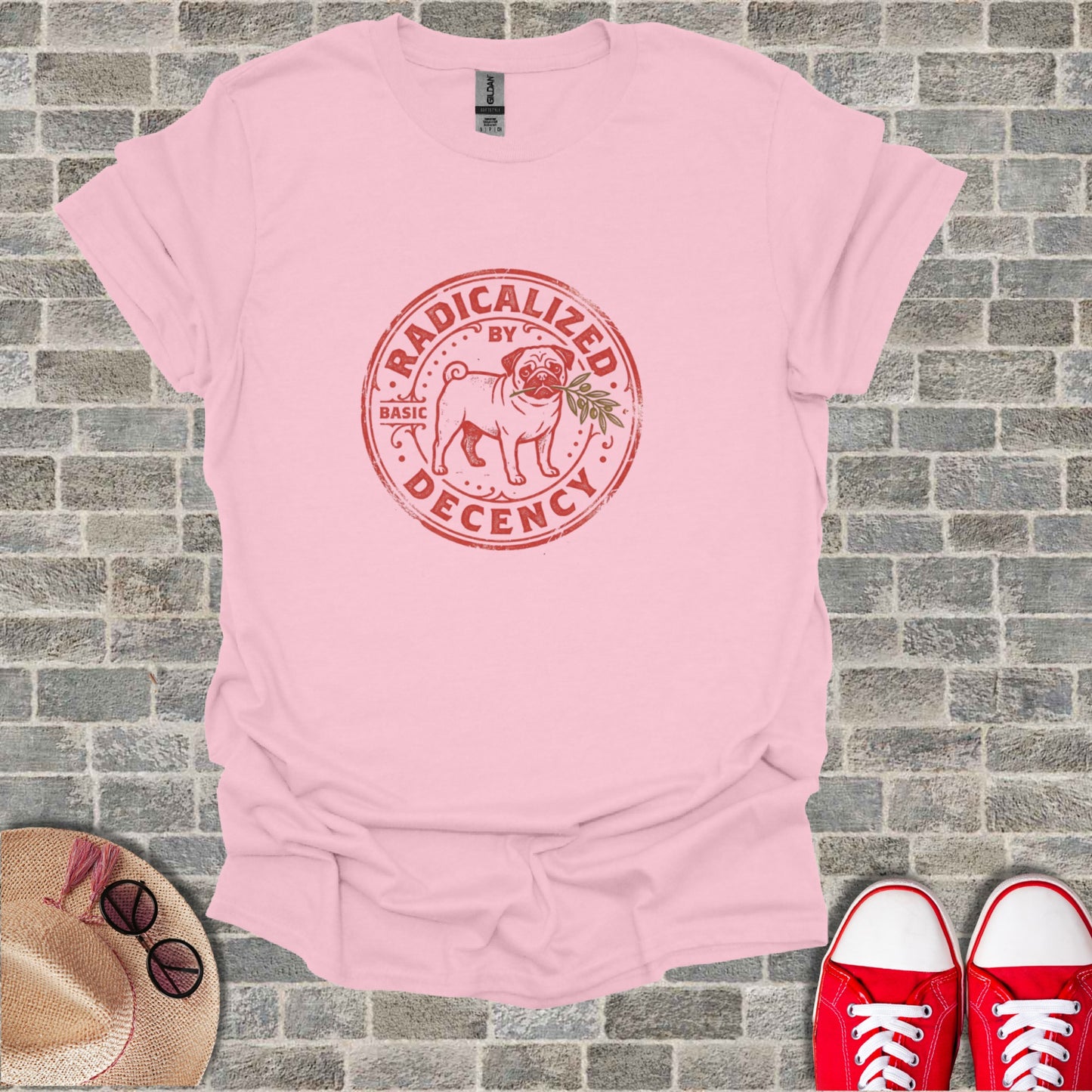 Pink t-shirt with "Radicalized by Basic Decency" pug logo.
