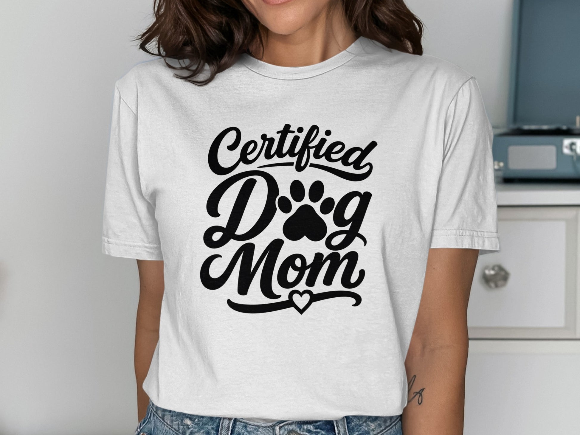 White t-shirt with "Certified Dog Mom" and paw print text.