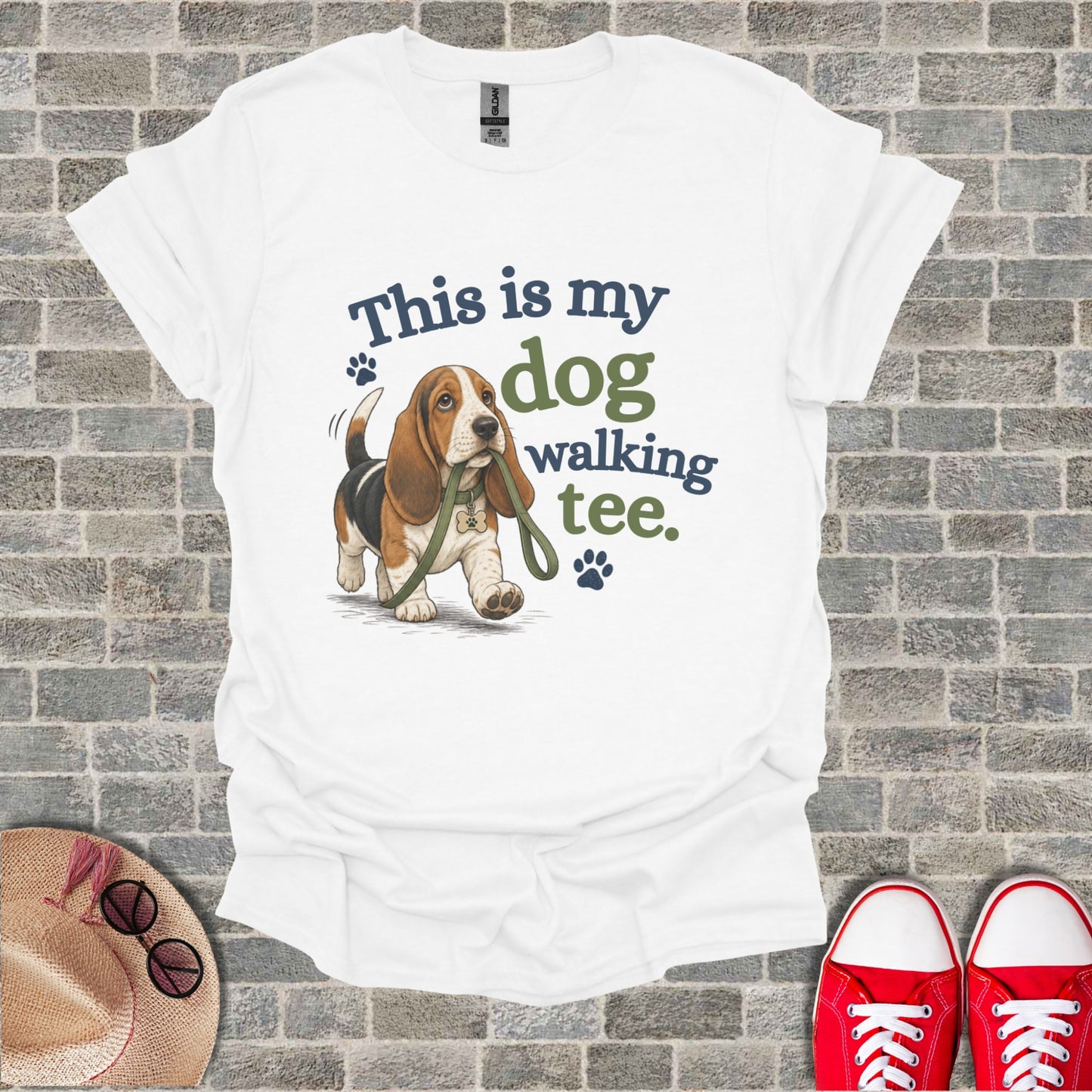 White t-shirt with a Basset Hound graphic and text "This is my dog walking tee."