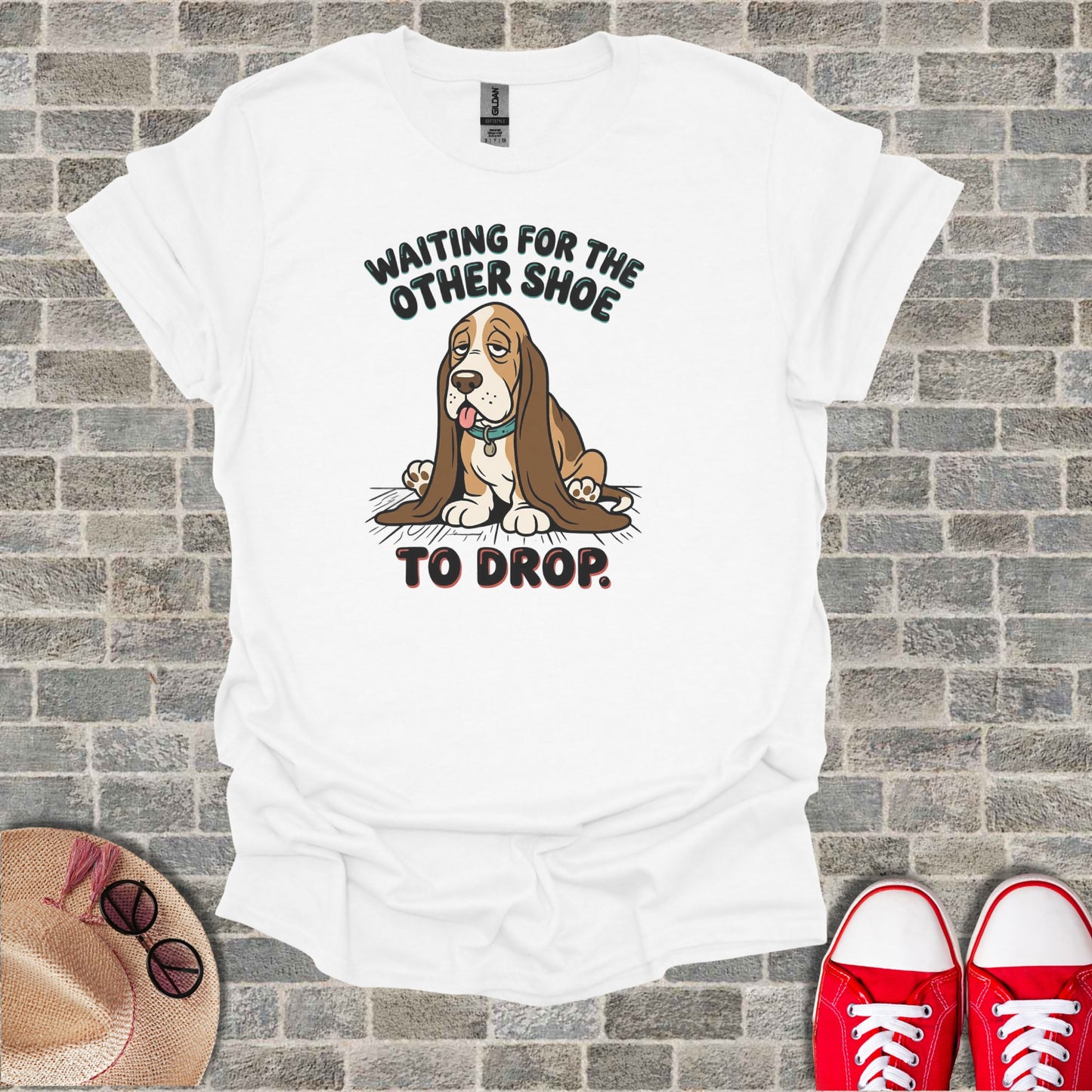 White t-shirt with a sad Basset Hound and text "WAITING FOR THE OTHER SHOE TO DROP."