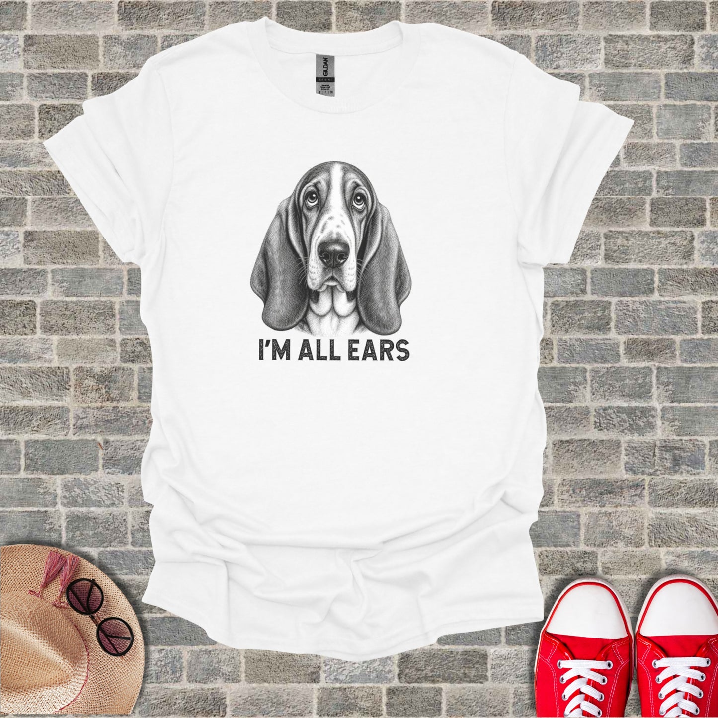 White t-shirt with a sketched basset hound and text "I'M ALL EARS".
