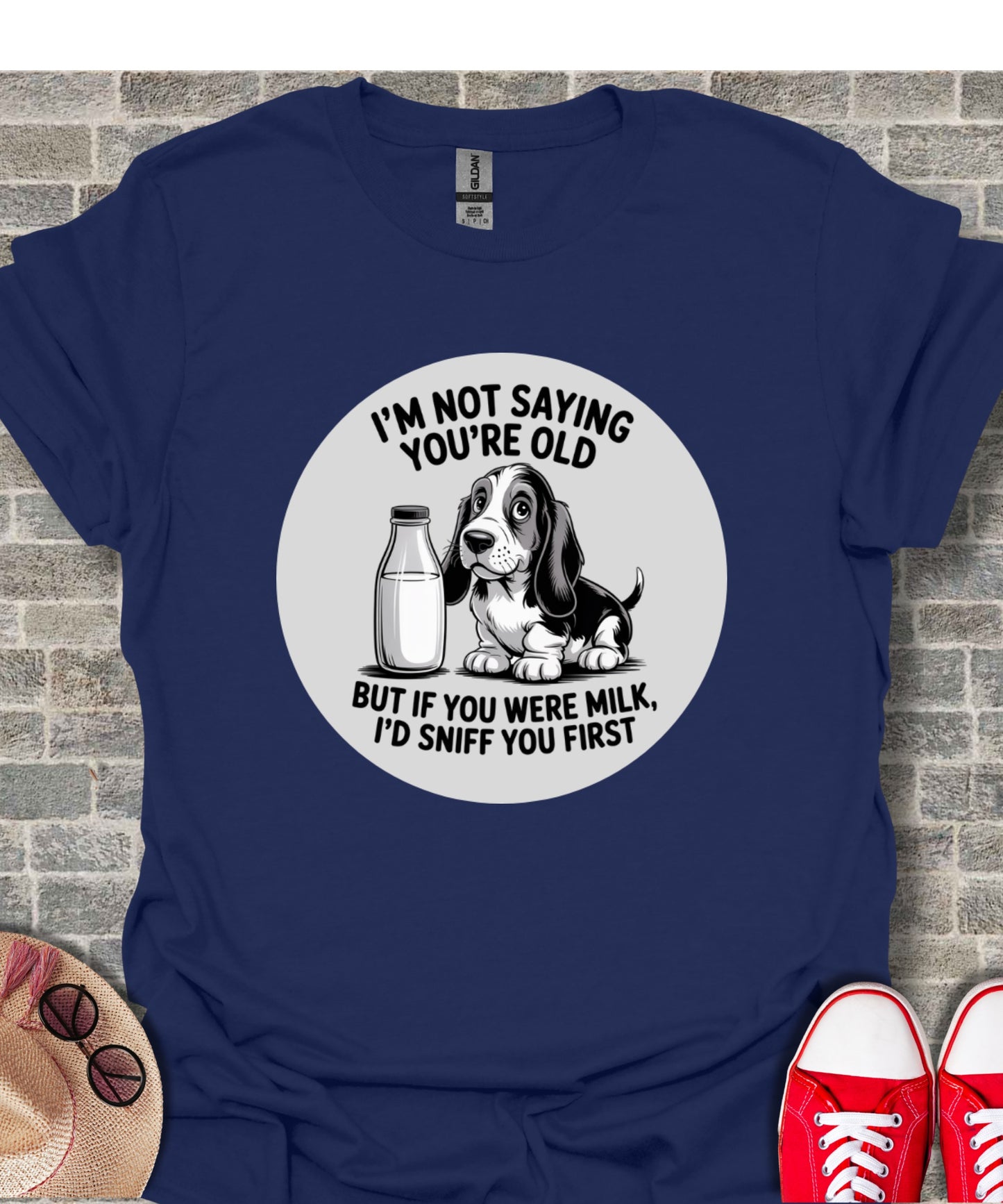Dark blue t-shirt with a cartoon dog and milk bottle with text.
