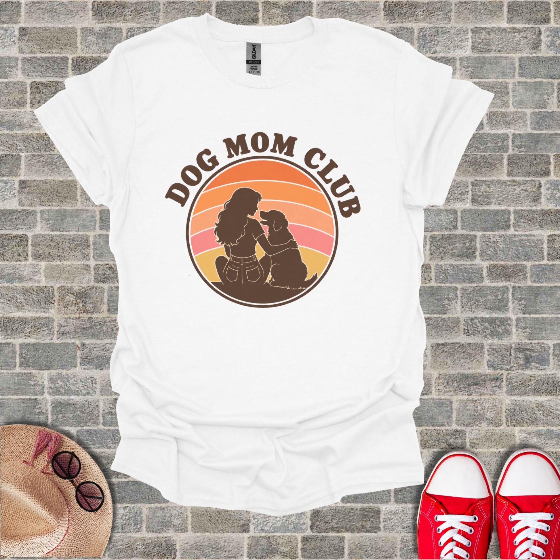 White t-shirt with "Dog Mom Club" circular graphic featuring a woman and dog silhouette.