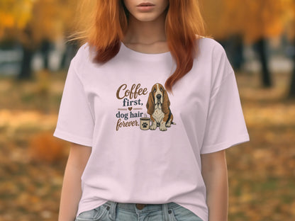 White t-shirt with "Coffee first, dog hair forever" and a basset hound.
