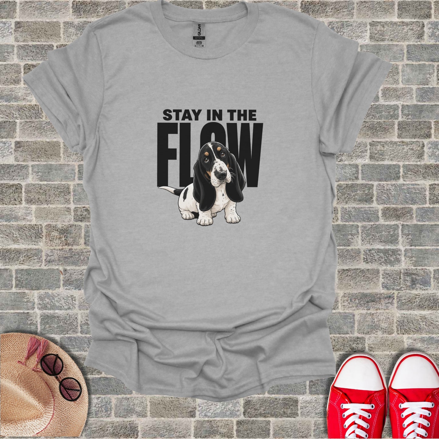 Basset hound wearing a bandana with "STAY IN THE FLOW" text.