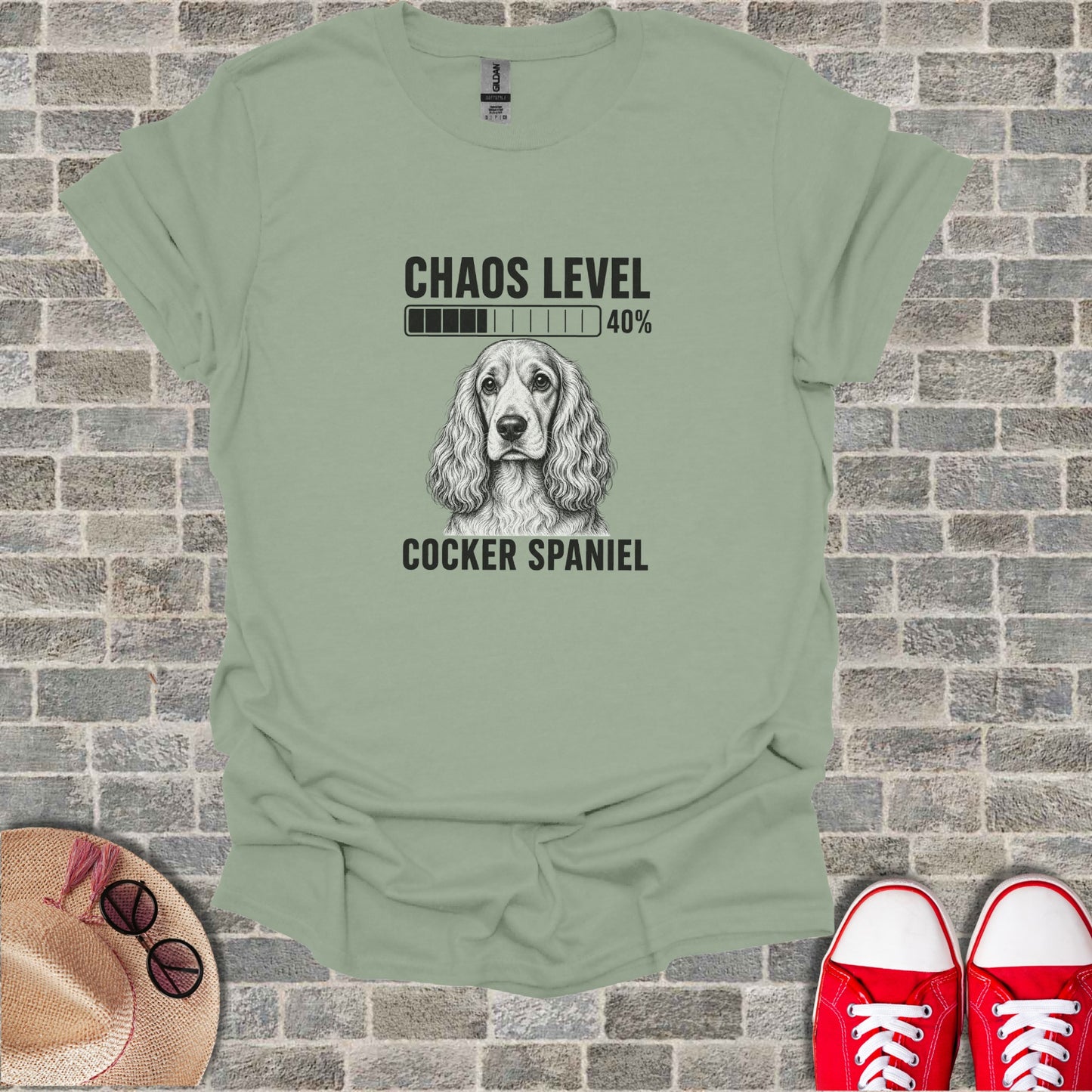 Green t-shirt with "Chaos Level 40%" and a Cocker Spaniel graphic.