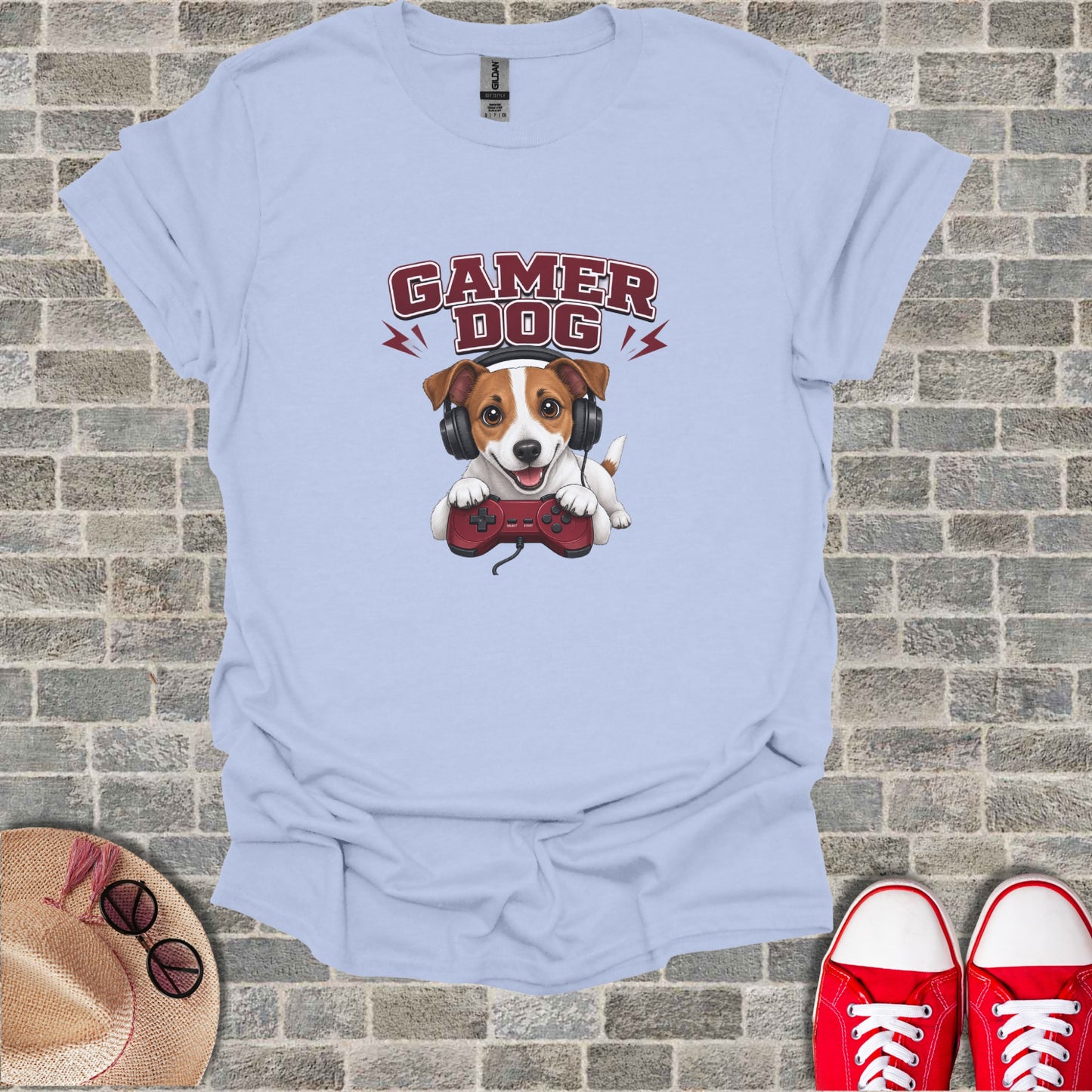 Light blue t-shirt with "GAMER DOG" text and a dog wearing headphones and holding a game controller.