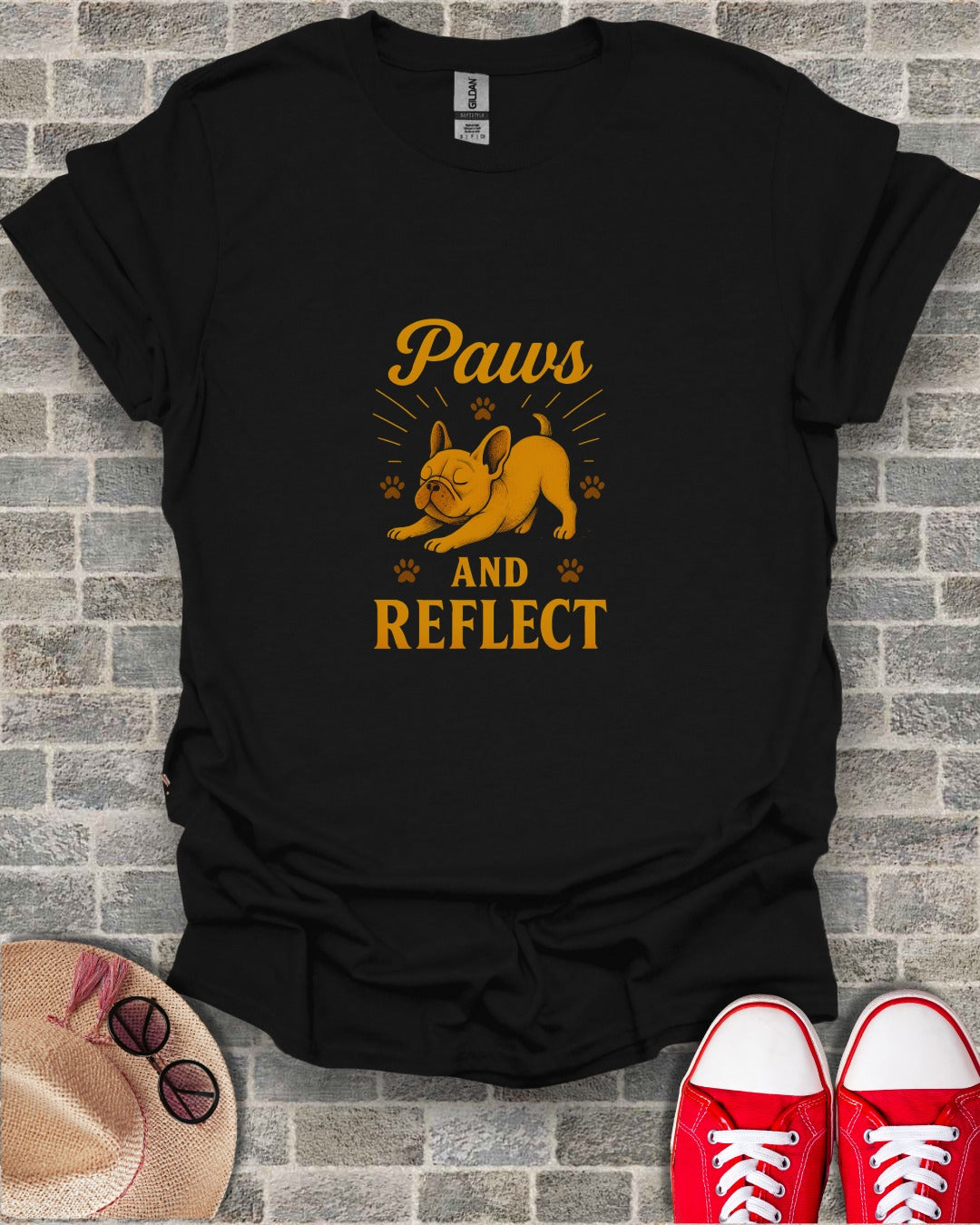 Black t-shirt with "Paws AND REFLECT" text and a French bulldog graphic.