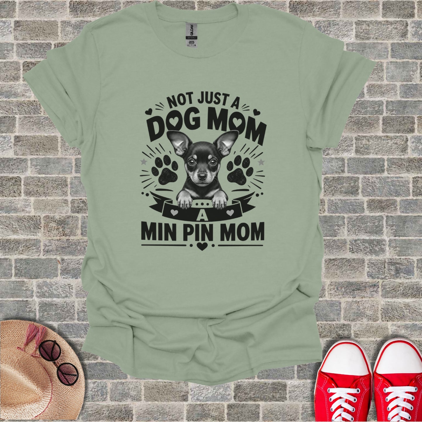 T-shirt with "Not Just A Dog Mom, A Min Pin Mom" text and chihuahua graphic.