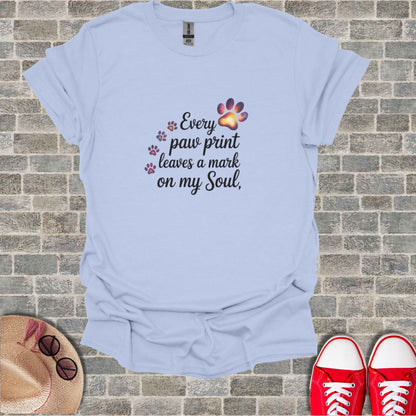 Light blue t-shirt with "Every paw print leaves a mark on my Soul" text.