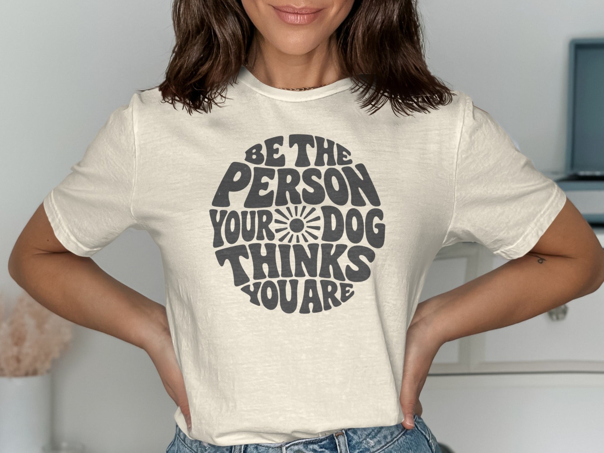Cream t-shirt with "Be the person your dog thinks you are" text.