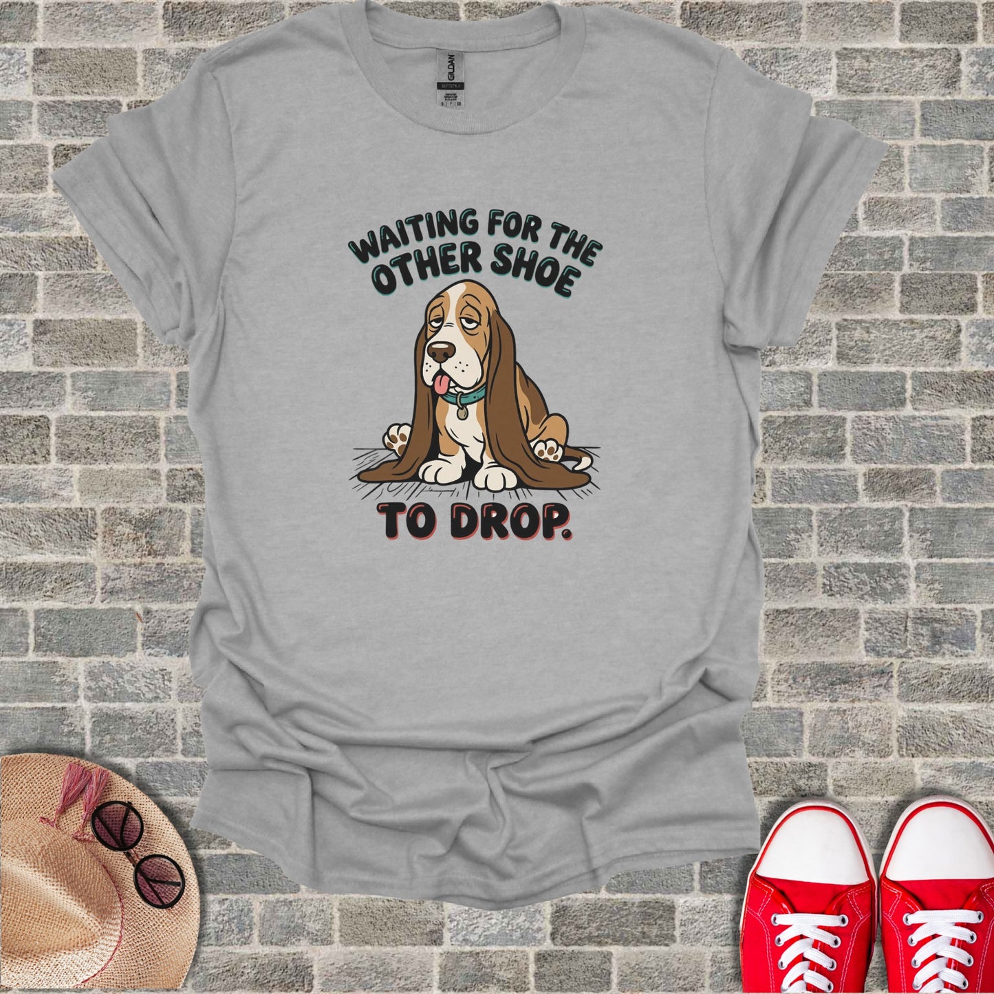 Gray t-shirt with a sad basset hound and text "WAITING FOR THE OTHER SHOE TO DROP."