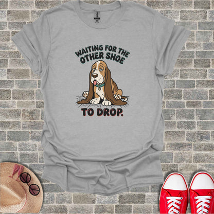 Gray t-shirt with a sad basset hound and text "WAITING FOR THE OTHER SHOE TO DROP."
